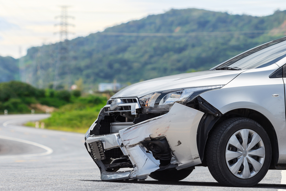 Front-end vehicle damage after crash showing insurance reimbursement and subrogation scenario