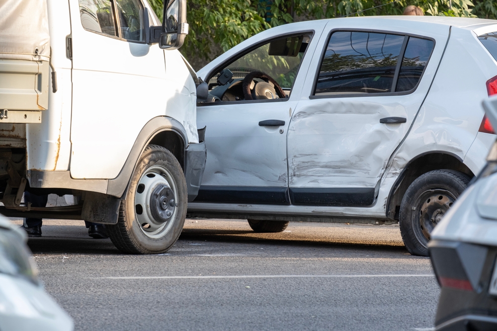 Side-impact car collision involving truck demonstrating insurance subrogation dispute